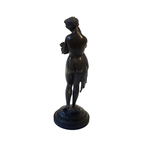 370 - A 19TH CENTURY CONTINENTAL BRONZE FIGURE
Classical form maiden with hand mirror, on black slate base... 