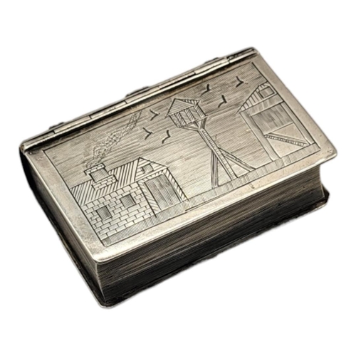 128 - A VICTORIAN SILVER NOVELTY 'BOOK' SNUFF BOX
Having engraved landscape decoration of a dovecot with l... 