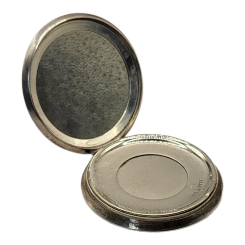 130 - AN EARLY 20TH CENTURY SILVER AND GUILLOCHÉ ENAMEL POWDER COMPACT
White enamel border with black enam... 