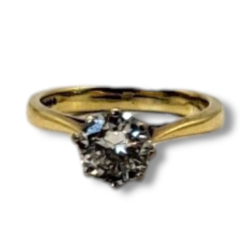 134 - A VINTAGE 18CT GOLD AND 1.25CT DIAMOND SOLITAIRE RING
The single round cut diamond set in a plain go... 