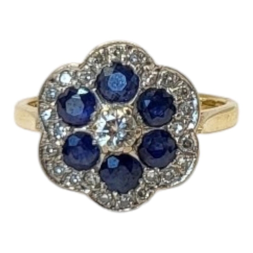 135 - A VINTAGE 18CT GOLD DIAMOND AND SAPPHIRE CLUSTER RING
Having an arrangement of round cut stones form... 