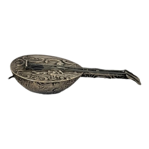 137A - A 19TH CENTURY CONTINENTAL SILVER NOVELTY MANDOLIN
Having an embossed design of a child fishing.
(Ap... 