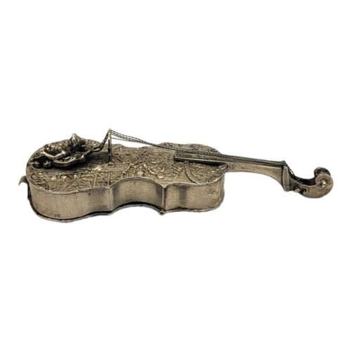 138A - A VICTORIAN SILVER NOVELTY CELLO SNUFF BOX
Having a hinged compartment to rear and embossed tavern s... 