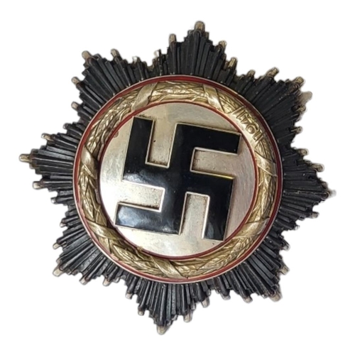 150 - A GERMAN WW2 CROSS, SILVER, DATED 1941 With eleven rivet back,the pin impressed with the number 2 in... 