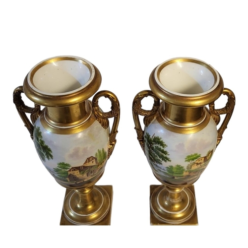 160 - A PAIR OF EARLY 19TH CENTURY CONTINENTAL PORCELAIN CAMPANA SHAPED TWIN HANDLED PEDESTAL VASES
Centra... 