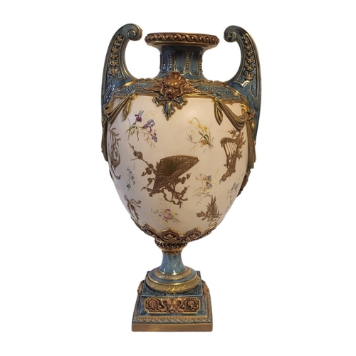 177 - ROYAL WORCESTER, A LOUIS XVI ROCOCO STYLE JEWELLED TWIN HANDLED CENTREPIECE VASE
On square polished ... 