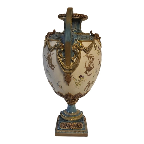 177 - ROYAL WORCESTER, A LOUIS XVI ROCOCO STYLE JEWELLED TWIN HANDLED CENTREPIECE VASE
On square polished ... 