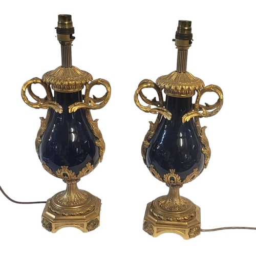 186 - A PAIR OF FINE 19TH CENTURY FRENCH EMPIRE STYLE ORMOLU GILT MOUNTED PORCELAIN LAMP BASES
Baluster fo... 