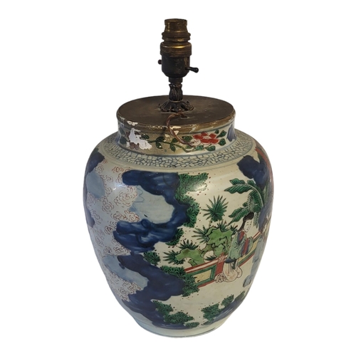 203 - AN 18TH CENTURY CHINESE FAMILLE ROSE/VERTE BALUSTER SHAPED LAMP BASE
Polychrome painted with a conti... 