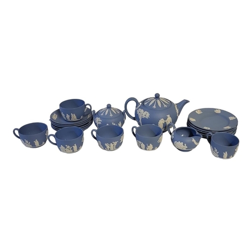 214 - WEDGWOOD, A VINTAGE PALE BLUE AND WHITE JASPERWARE,TEA SERVICE
Comprising a teapot, sugar basin, cre... 