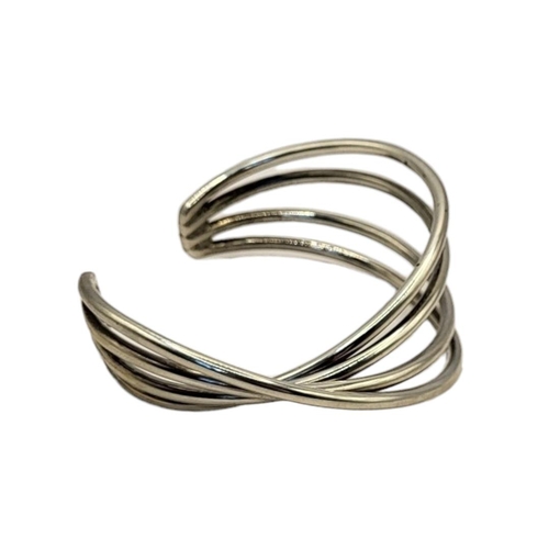 23 - GEORG JENSEN, A VINTAGE DANISH SILVER BANGLE
Four strand in a half twist design, oval mark with 925
... 