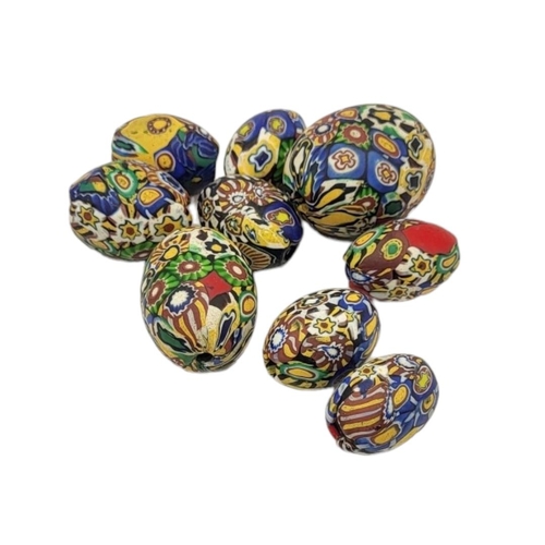 239 - A COLLECTION OF VINTAGE MURANO GLASS MILLEFIORI BEADS
Oval graduated oval form 
(largest approx 3cm)... 