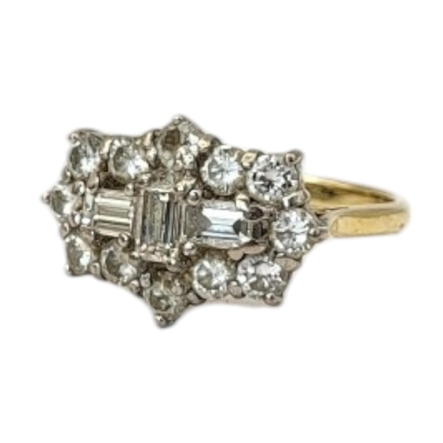 53 - AN 18CT GOLD AND DIAMOND CLUSTER RING
Three baguette cut diamonds central cruciform edged with twelv... 