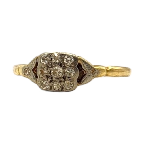 63 - AN EARLY 20TH CENTURY YELLOW METAL AND DIAMOND CLUSTER RING
Having an arrangement of nine round cut ... 