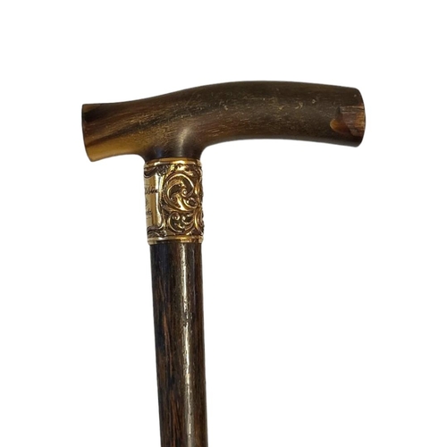 66 - SIR DUNCAN HILSTON M.D BERMUDA, A VICTORIAN HORN HANDLED WALKING CANE
Having an engraved yellow meta... 