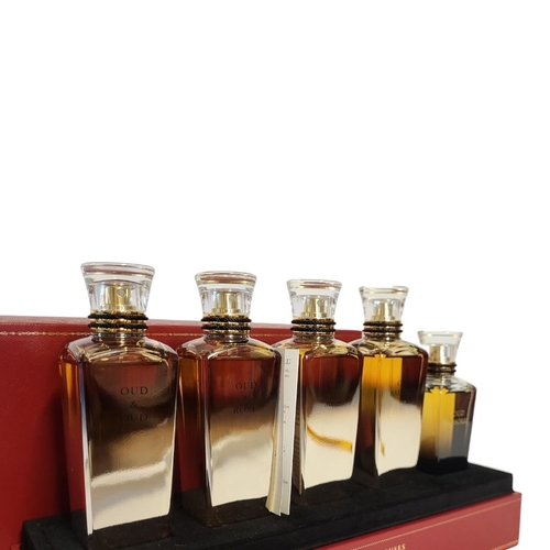 7 - CARTIER, A CASED 'LES HEURES VOYAGEUSES' FIVE PERFUME BOTTLE SET
Titled 'Oud and Oud, Oud and Rose, ... 