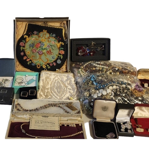 71 - A COLLECTION OF VINTAGE COSTUME JEWELLERY
To include necklaces, gilt metal jewellery, cufflinks and ... 