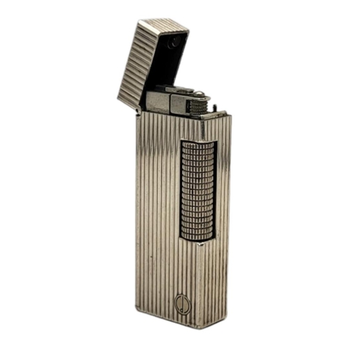 78 - DUNHILL, A VINTAGE WHITE METAL CIGARETTE LIGHTER
Reeded case marked number 22385, in Dunhill box.
(a... 