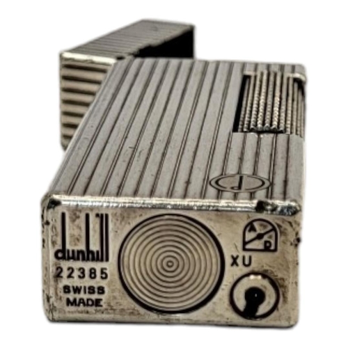 78 - DUNHILL, A VINTAGE WHITE METAL CIGARETTE LIGHTER
Reeded case marked number 22385, in Dunhill box.
(a... 