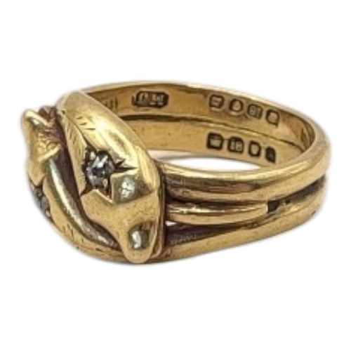 95 - AN EARLY 20TH CENTURY 18CT GOLD AND DIAMOND SNAKE RING
Entwined snakes set with round cut diamonds.
... 