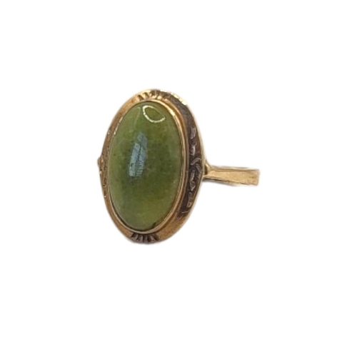 97 - A VINTAGE 9CT GOLD AND JADE RING
Cabochon cut stone in a collet mount.
(size L)

Condition: good