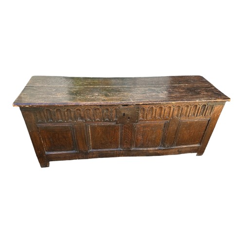 587 - A 17TH CENTURY ELM AND OAK COFFER
With arched frieze above four panels on stile feet.
(135cm x 45cm ... 