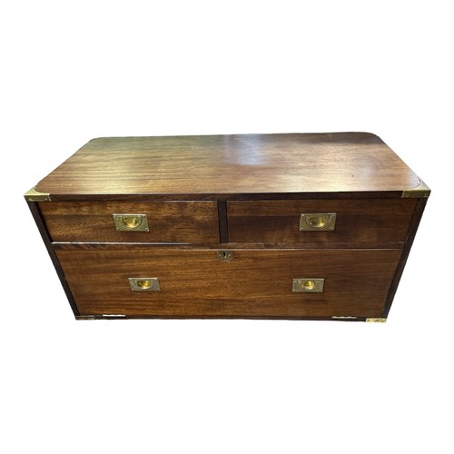 589 - A TEAK MILITARY CHEST
Half section along with a military tray top table.
(105cm x 46cm x 51cm)

Cond... 