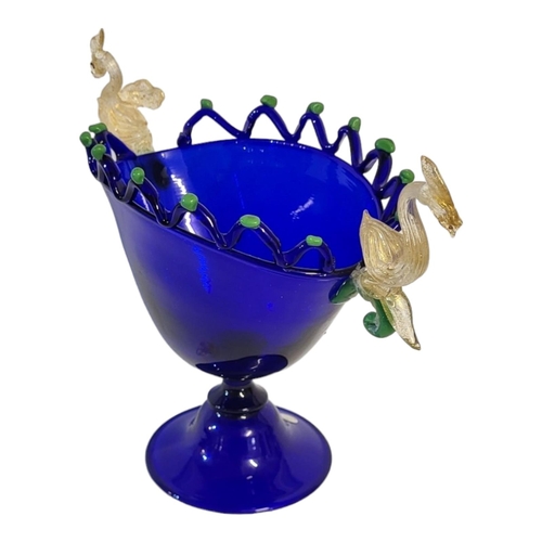 187 - AN ITALIAN MURANO HAND BLOWN DARK BLUE GLASS PEDESTAL BOWL
Applied to both sides with gilded glass s... 