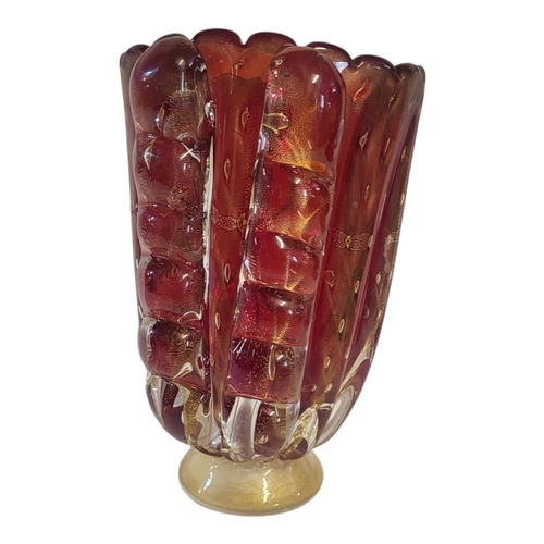 222A - A MID 20TH CENTURY ITALIAN MURANO TOGO HAND BLOWN IRON RED TEXTURED ART GLASS VASE OF FREEFORM 
The ... 