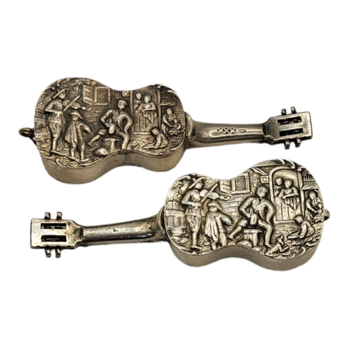 27 - A PAIR OF EARLY 20TH CENTURY DUTCH SILVER NOVELTY GUITARS
Having embossed figural decoration.
(appro... 