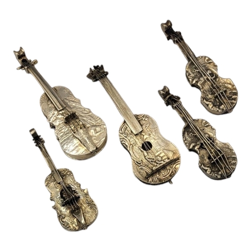 29 - A COLLECTION OF  FIVE EARLY 20TH CENTURY CONTINENTAL SILVER NOVELTY MUSICAL INSTRUMENTS
Comprising a... 