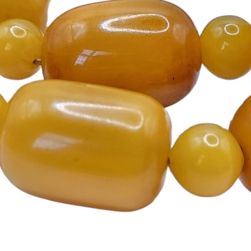 3 - A VINTAGE BUTTERSCOTCH RECTANGULAR AMBER NECKLACE 
Beads with spherical spacers links, together with... 