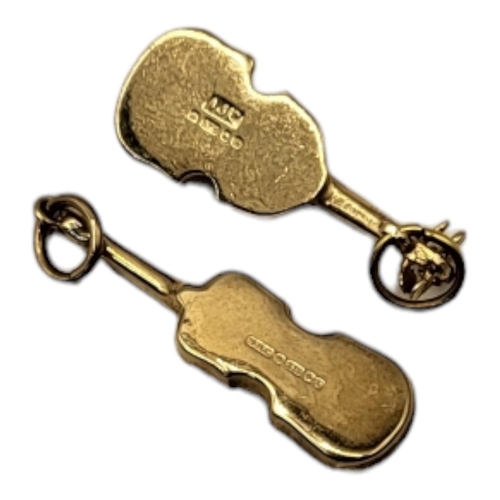 32 - TWO VINTAGE 9CT GOLD 'VIOLIN' CHARMS
Each having a hanging bale.
(approx 2cm)
 
Condition: good