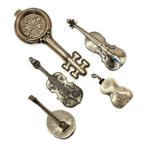 36 - REED & BARTON, A STERLING SILVER NOVELTY WINE TASTERS KEY, CIRCA 1880
Along with an early 20th Centu... 