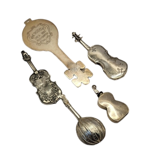 36 - REED & BARTON, A STERLING SILVER NOVELTY WINE TASTERS KEY, CIRCA 1880
Along with an early 20th Centu... 