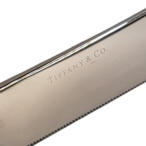 43 - TIFFANY AND CO., A STERLING SILVER HANDLED WEDDING CAKE KNIFE
Wheatsheaf design to handle and stainl... 