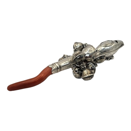 45 - A GEORGIAN SILVER AND CORAL CHILD'S RATTLE
Having a whistle finial, eight bells, engraved decoration... 