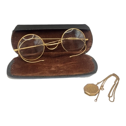 49 - A PAIR OF VICTORIAN YELLOW METAL PINCE NEZ SPECTACLES
In a protective box, together with a 9ct gold ... 