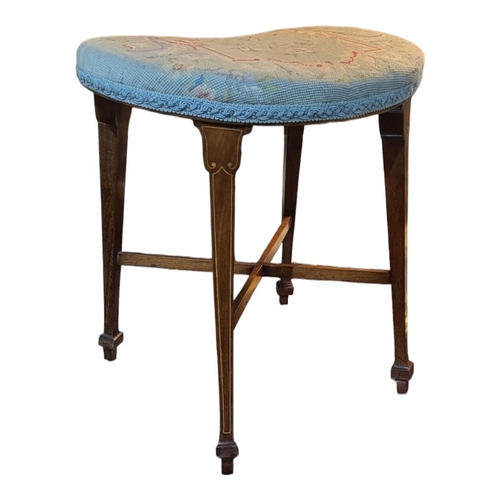 501 - AN EDWARDIAN SHERATON REVIVAL INLAID MAHOGANY STOOL 
Raised on tapering legs and x shaped supports, ... 