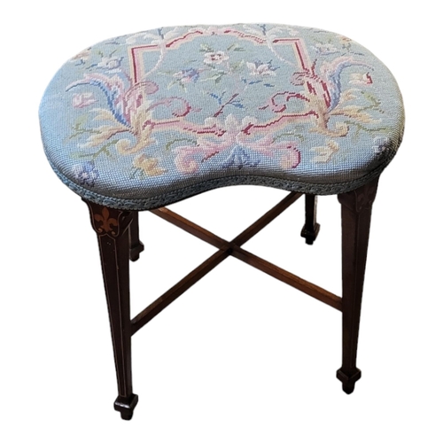 501 - AN EDWARDIAN SHERATON REVIVAL INLAID MAHOGANY STOOL 
Raised on tapering legs and x shaped supports, ... 