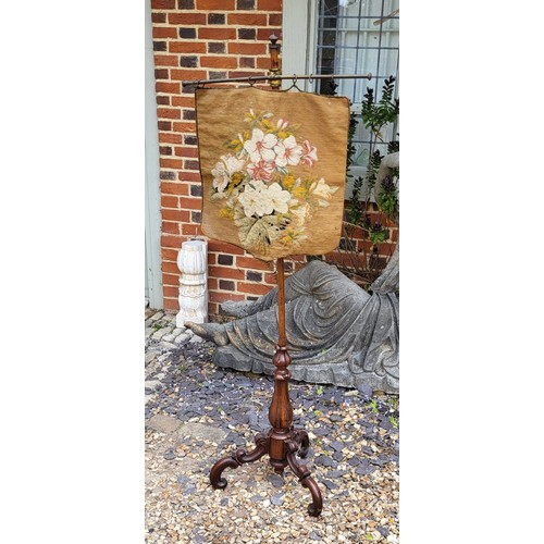 509 - A VICTORIAN WALNUT TAPESTRY FIRE SCREEN
Adjustable support on central column, with carved tulip stem... 