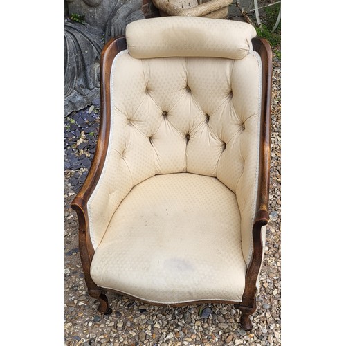 512 - A VICTORIAN MAHOGANY TUB NURSING ARMCHAIR
With cushioned headrest and button back upholstery on bow ... 