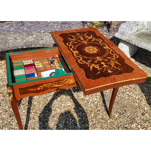 505 - DAL NEGRO, A 20TH CENTURY ITALIAN WALNUT AND MARQUETRY GAMES/ROULETTE TABLE
Having inlaid floral pan... 