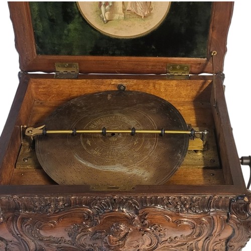 203 - SCHUTZ MARKE OF GERMANY, SYMPHONION DISC MUSIC BOX
Contained in a walnut Rococo style carved case, t... 