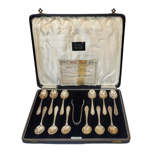 55 - AN UNUSUAL CASED SET OF TWELVE STERLING SILVER TEASPOONS AND MATCHING SUGAR TONGS
Beaing import mark... 