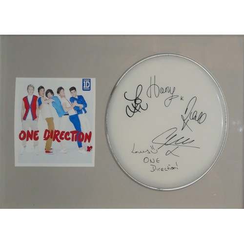 417 - ONE DIRECTION, AN ORIGINAL AUTOGRAPHED DRUM SKIN
Signed by Harry Styles and all members, in a fitted... 