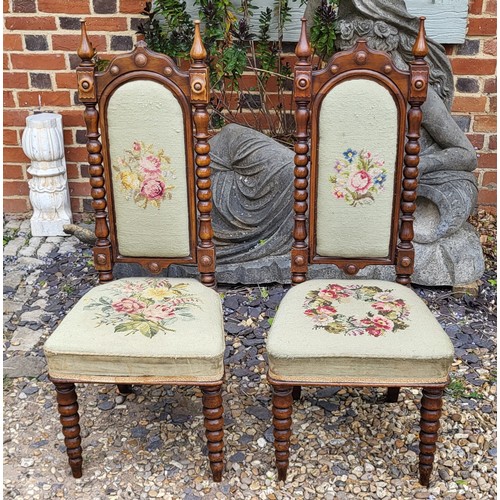 506 - A PAIR OF VICTORIAN MAHOGANY PRIEDIEU CHAIRS
With tapestry upholstery on carved Gothic design back, ... 