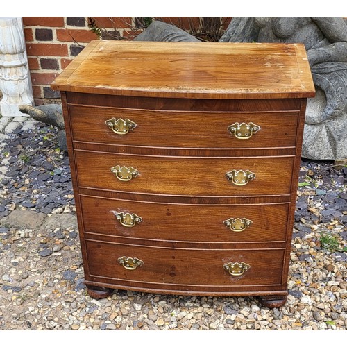 507 - A 19TH CENTURY MAHOGANY BOW- FRONTED COMMODE
The hinged lid and brass handle escutcheons, terminatin... 