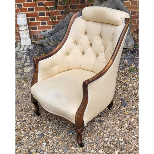 512 - A VICTORIAN MAHOGANY TUB NURSING ARMCHAIR
With cushioned headrest and button back upholstery on bow ... 