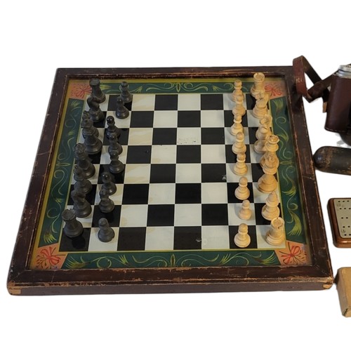 231 - A LATE VICTORIAN REVERSE GLASS CHESS BOARD
Hand painted with green border and outer frame, together ... 